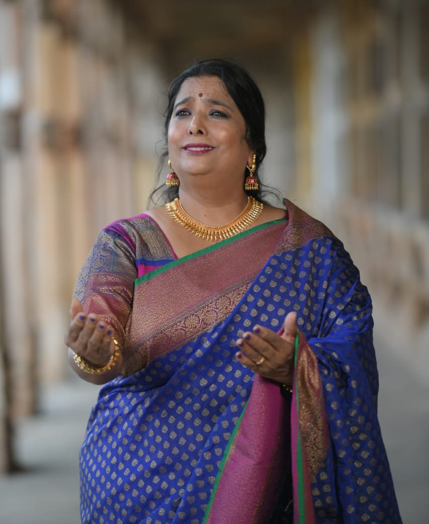 Studio portrait — Dr Veena Murthy Vijay, three-quarter, warm side light